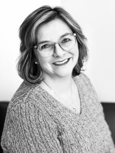 woman smiling in sweater