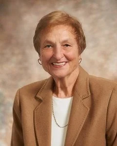 Woman in tan suit
